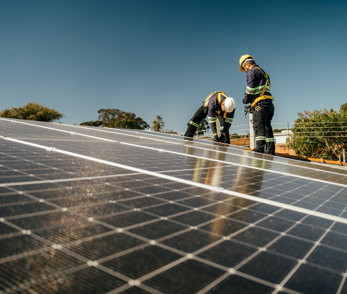 Workers setting up solar energy system